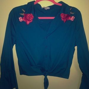 Shirt with flower bunches on shoulders